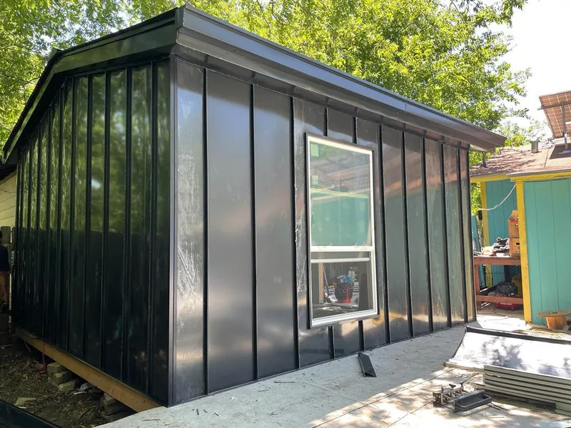 Black standing seam metal wall panels for Roof Inspection in Gray